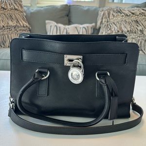 Michael kors black purse,12 inches long by 8.5 inches high,like new condition.